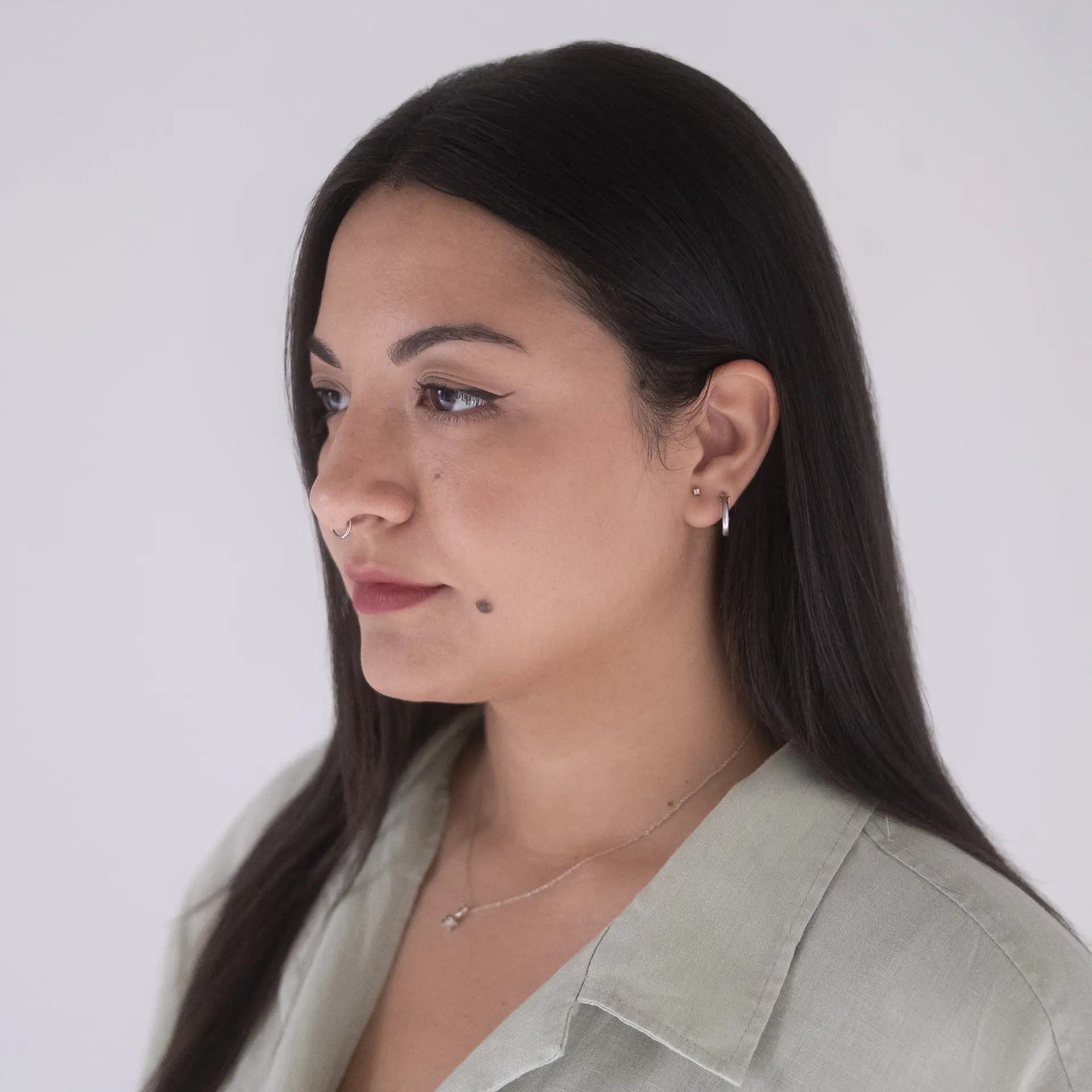 A photo of Cristina La Porta's head and shoulders in profile on a white background